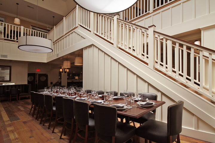 Our dining room welcomes you with vaulted ceilings and dark wood accents